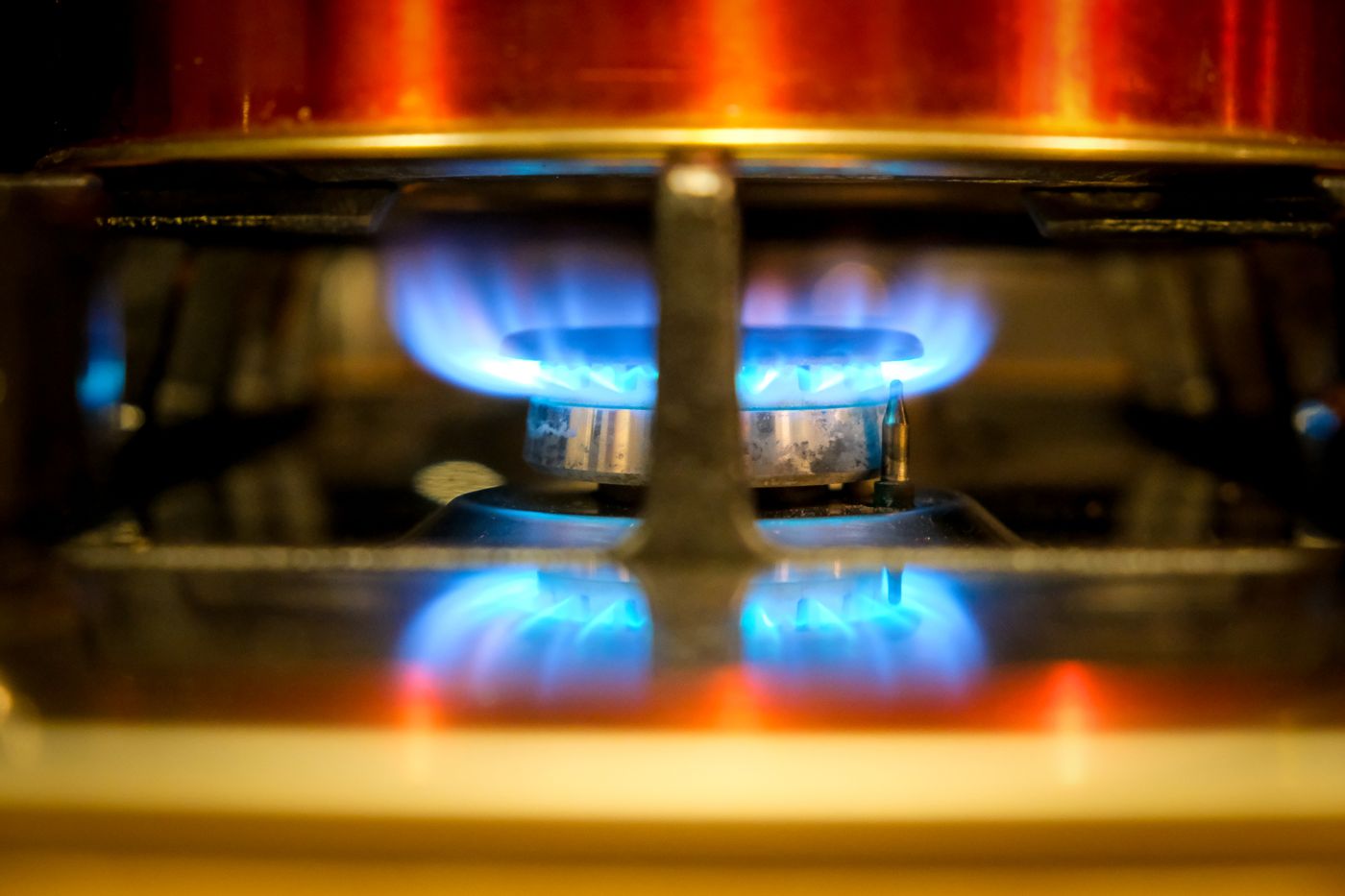 The blue flame of a domestic gas burner, closely framed.